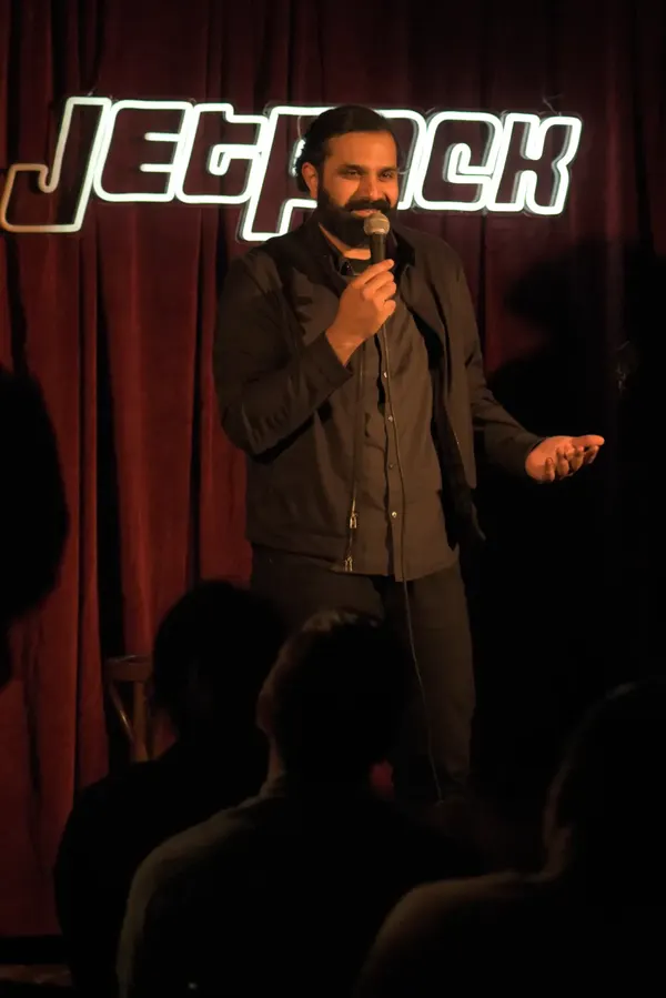 A comedian on the Jetpack stage