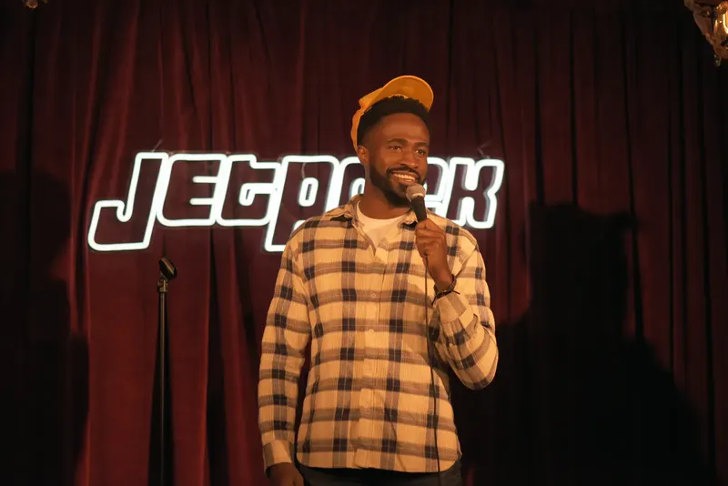 A comedian on the Jetpack stage