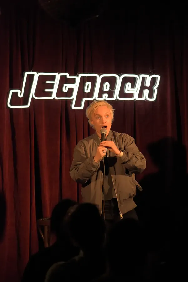 A comedian on the Jetpack stage