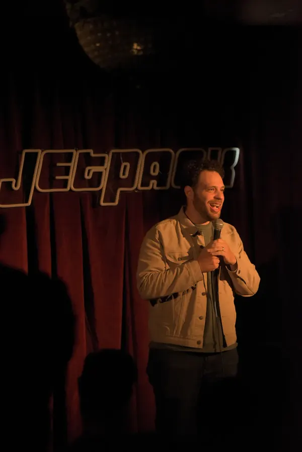 A comedian on the Jetpack stage