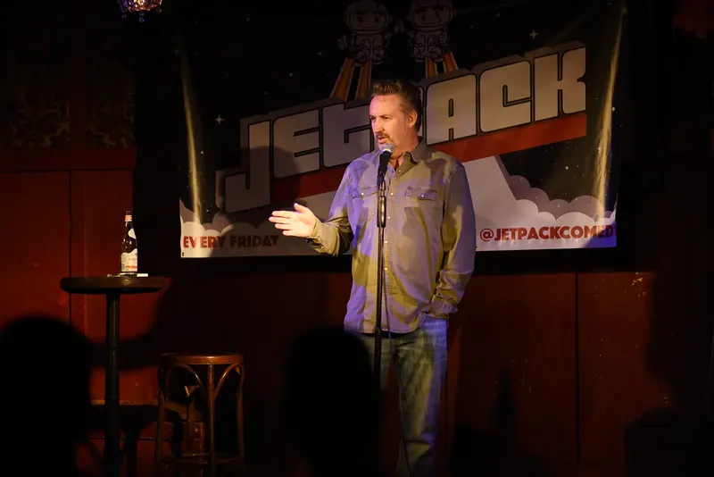 A comedian on the Jetpack stage