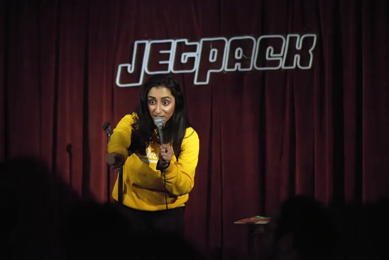 A comedian on the Jetpack stage