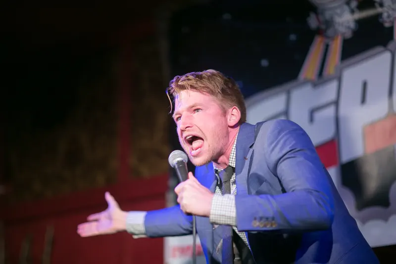 A comedian on the Jetpack stage