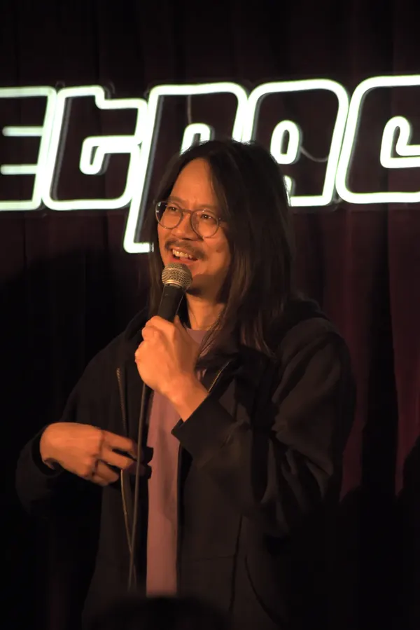 A comedian on the Jetpack stage
