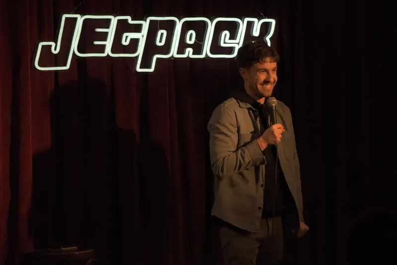 A comedian on the Jetpack stage